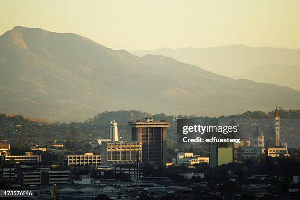 hazy sky line view of san salvador city - san salvador stock pictures, royalty-free photos & images