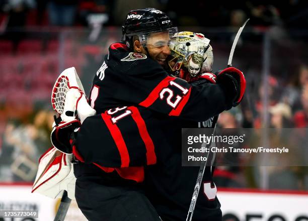 Mathieu Joseph of the Ottawa Senators celebrates with Anton Forsberg after a 5-2 win against the Philadelphia Flyers at Canadian Tire Centre on...