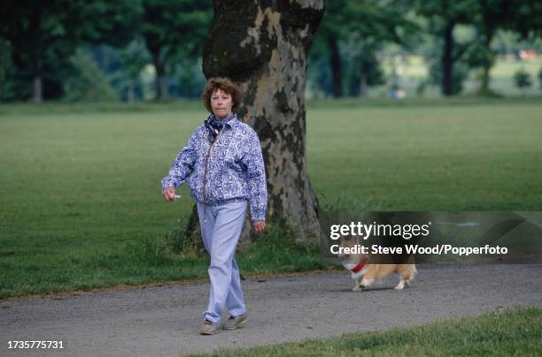 American actress Ava Gardner walks her dog in Hyde Park, London, England, circa 1986.