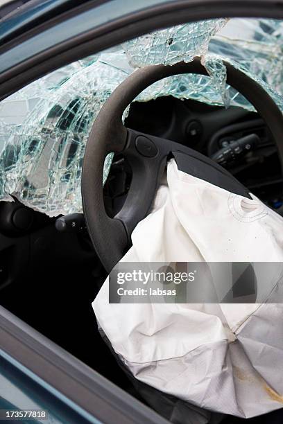 after affect of a car accident showing a deployed airbag - airbag stockfoto's en -beelden