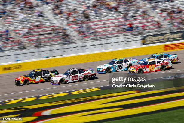 Josh Berry, driver of the LubeZone Chevrolet, leads Cole Custer, driver of the Haas Automation Ford, Chandler Smith, driver of the Barger...