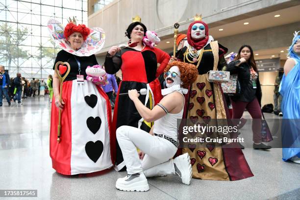 Cosplayers pose as Red Queen and Freddie Mercury Red Queen during New York Comic Con 2023 - Day 3 at Javits Center on October 14, 2023 in New York...