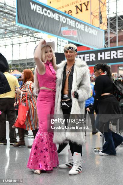 Cosplayers pose as Barbie and Ken during New York Comic Con 2023 - Day 3 at Javits Center on October 14, 2023 in New York City.