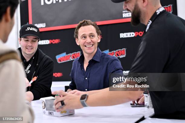 Tom Hiddleston signs autographs during New York Comic Con 2023 - Day 3 at Javits Center on October 14, 2023 in New York City.