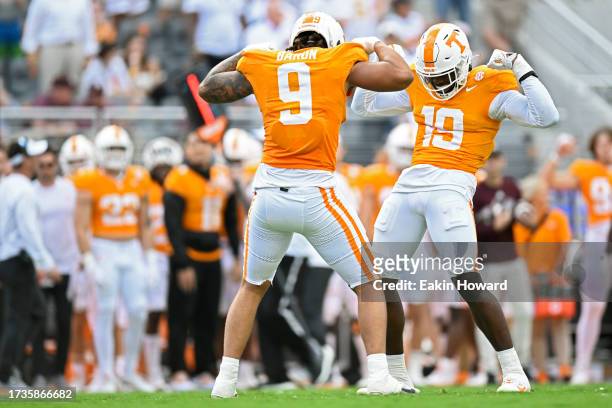 Tyler Baron and Joshua Josephs of the Tennessee Volunteers celebrate a sack against the Texas A&M Aggies in the second quarter at Neyland Stadium on...