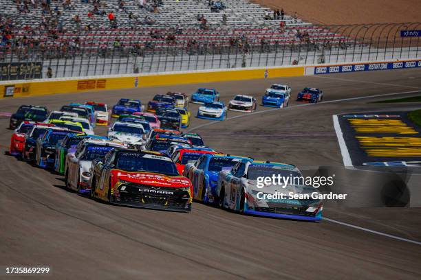 Josh Berry, driver of the LubeZone Chevrolet, and Chandler Smith, driver of the Barger Precast/Quick Tie Products Inc Chevrolet, race during the...