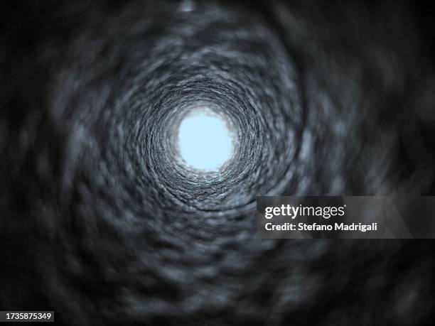 tunnel - deep hole stock pictures, royalty-free photos & images