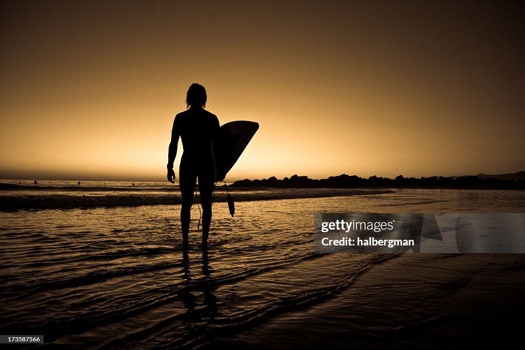 Lone surfer on the beach