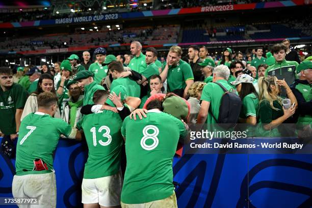 Josh Van der Flier, Garry Ringrose and Caelan Doris of Ireland are consoled by members of the crowd at full-time after their team's loss in the Rugby...