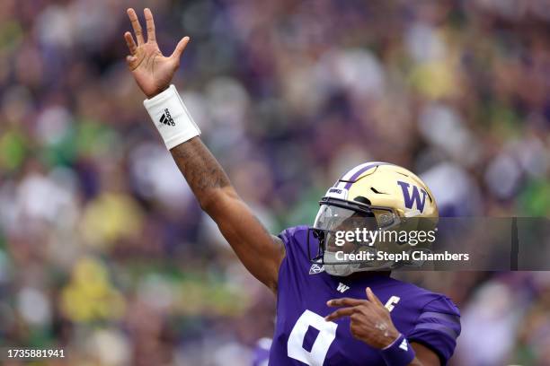 Michael Penix Jr. #9 of the Washington Huskies celebrates a touchdown against the Oregon Ducks during the first quarter at Husky Stadium on October...