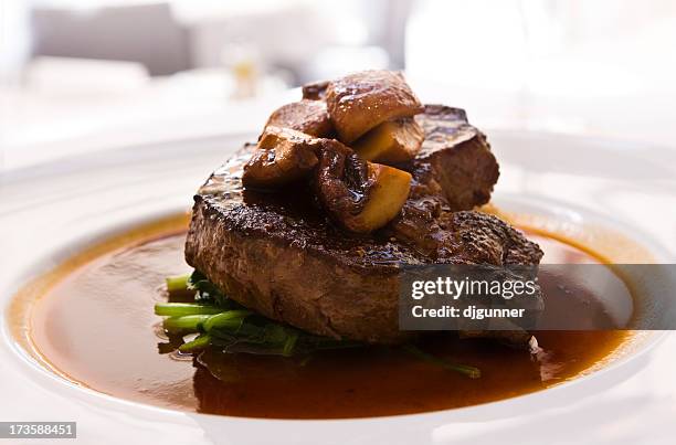 steam and mushrooms for a hearty feast to usher in the fall  - biefstuk stockfoto's en -beelden