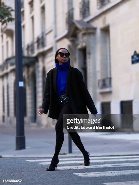 Emilie Joseph @in_fashionwetrust wears a black oversized boyfriend blazer jacket by frankieshop, embroidered / embellished /sequined shorts / panties...