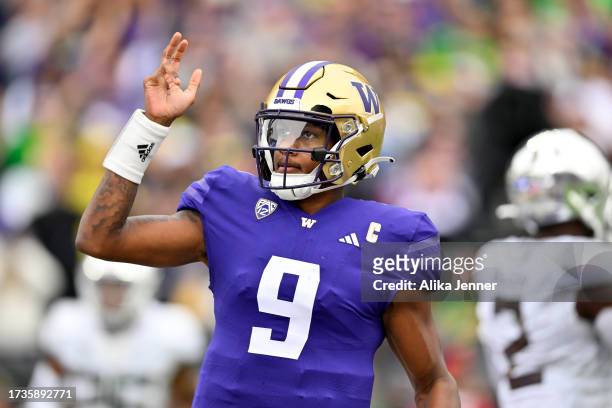 Michael Penix Jr. #9 of the Washington Huskies waves during the first quarter against the Oregon Ducks at Husky Stadium on October 14, 2023 in...