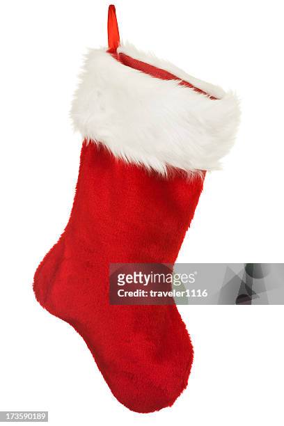 isolated red christmas stocking a holiday ornament - kousen stockfoto's en -beelden