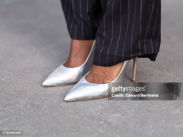 Emilie Joseph @in_fashionwetrust wears holographic leather pumps shoes by Cosmoparis, during a street style fashion photo session, on October 14,...