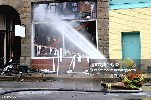 store front - fire hose stock pictures, royalty-free photos & images