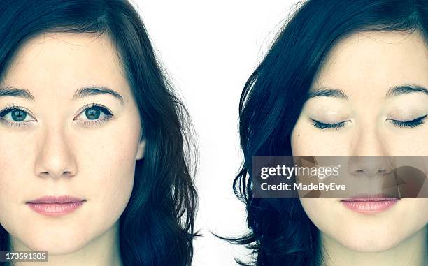 identical twins posing, one with eyes open, the other closed - eye open stockfoto's en -beelden