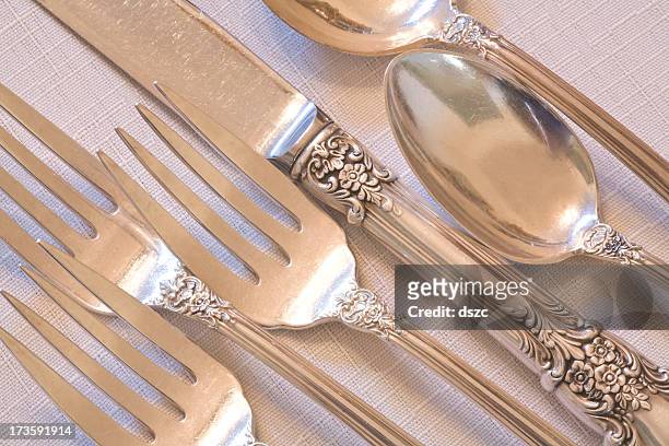 fine dining elegant antique silverware place setting - knife and fork stock pictures, royalty-free photos & images
