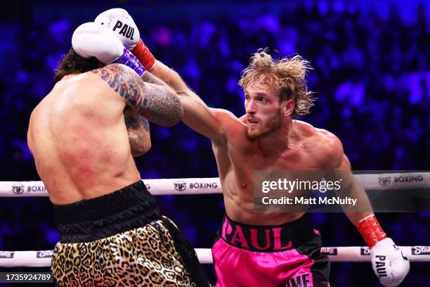 Logan Paul punches Dillon Danis during the Misfits Heavyweight fight between Logan Paul and Dillon Danis at AO Arena on October 14, 2023 in...