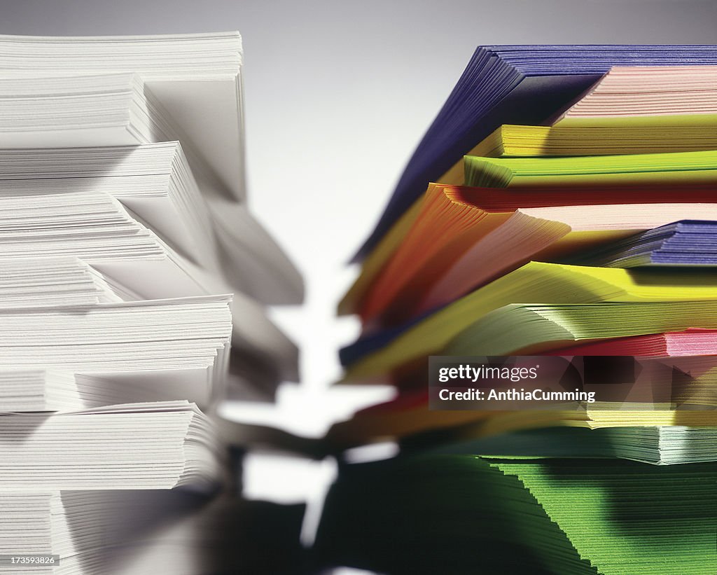 Stacks of White and Colored Paper