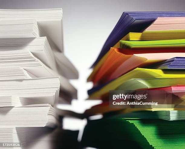 stacks of white and colored paper - ream of paper stock pictures, royalty-free photos & images