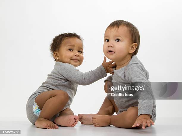 due bambini - baby white background foto e immagini stock