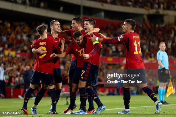 Alvaro Morata of Spain celebrates with teammates after scoring the team's first goal during the UEFA EURO 2024 European qualifier match between Spain...