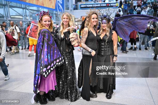 Cosplayers posing as A Court of Thorns and Roses characters during New York Comic Con 2023 - Day 3 at Javits Center on October 14, 2023 in New York...