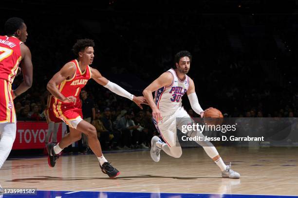 Furkan Korkmaz of the Philadelphia 76ers dribbles the ball during the game against the Atlanta Hawks on October 20, 2023 at the Wells Fargo Center in...