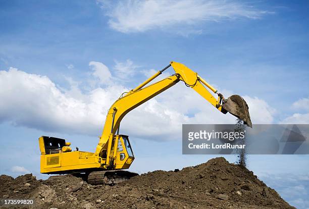 excavating - digging machine stock pictures, royalty-free photos & images