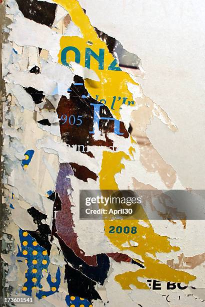 shredded wall paper poster with bits still on the wall - torn poster stock pictures, royalty-free photos & images