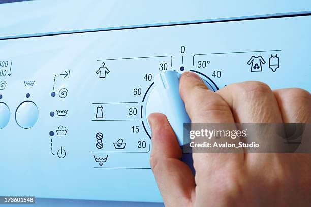 washing machine and hand - tvättmaskin bildbanksfoton och bilder