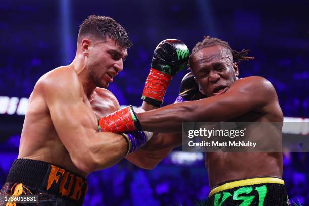 Tommy Fury punches KSI during the Misfits Cruiserweight fight between KSI and Tommy Fury at AO Arena on October 14, 2023 in Manchester, England.