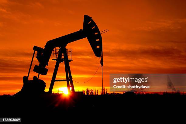 pumpjack as the sunrises - geologist stock pictures, royalty-free photos & images