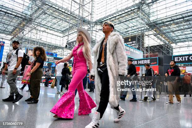 Cosplayers pose as Barbie and Ken during New York Comic Con 2023 - Day 3 at Javits Center on October 14, 2023 in New York City.