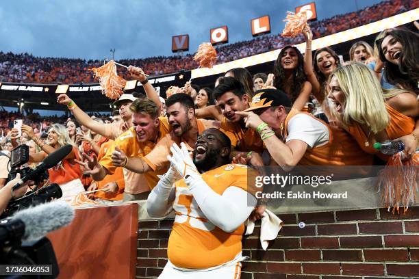 Isaac Green of the Tennessee Volunteers celebrates with the student section following their win over the Texas A&M Aggies at Neyland Stadium on...