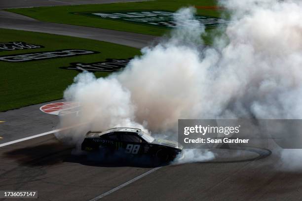 Riley Herbst, driver of the Monster Energy Ford, celebrates with a burnout after winning the NASCAR Xfinity Series Alsco Uniforms 302 at Las Vegas...