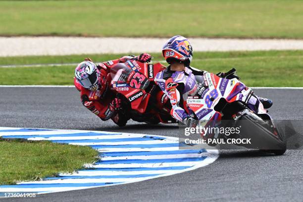 Prima Pramac's Spanish rider Jorge Martin leads Ducati Lenovo Team's Italian rider Enea Bastianini during the first qualifying session of the MotoGP...