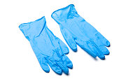 Pair of blue surgical gloves laying on white background
