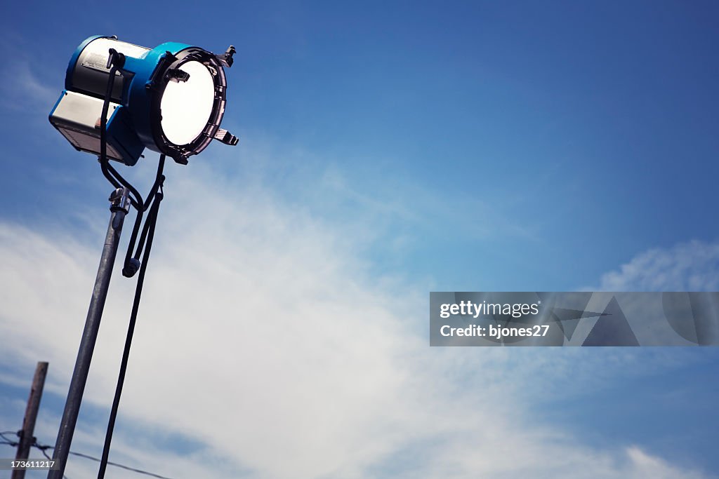 A single movie light with a sky background