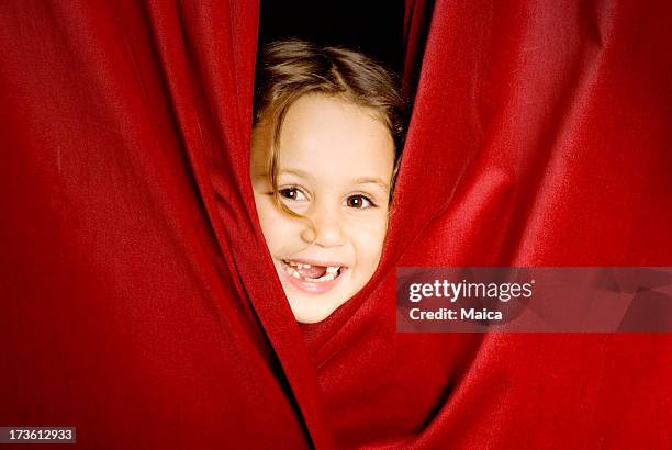 peeking through the curtain rail - children theater stock pictures, royalty-free photos & images