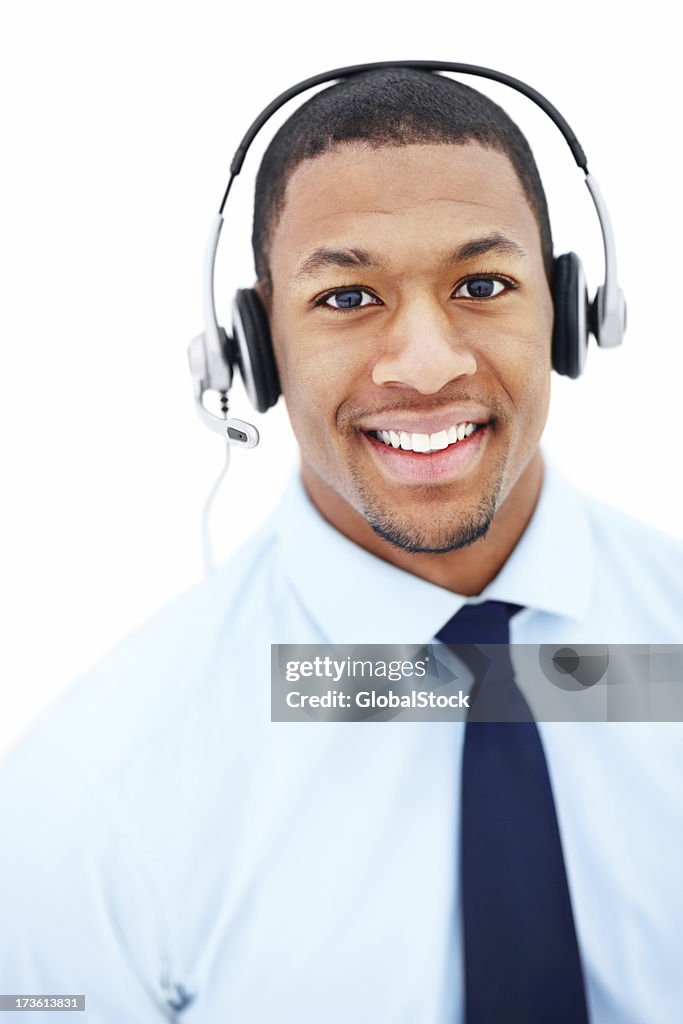 Businessman using headphones and smiling