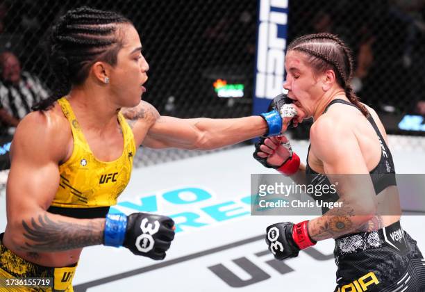 Viviane Araujo of Brazil punches Jennifer Maia of Brazil in a flyweight fight during the UFC Fight Night event at UFC APEX on October 14, 2023 in Las...