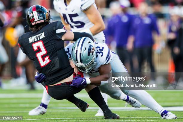 Desmond Purnell of the Kansas State Wildcats brings down Behren Morton of the Texas Tech Red Raiders after a pass during the first half of the game...