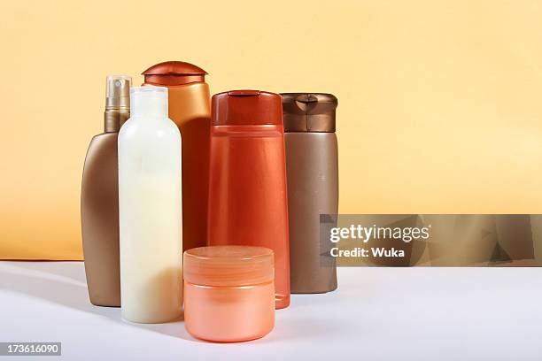 bottles of cosmetics - shampoo stockfoto's en -beelden