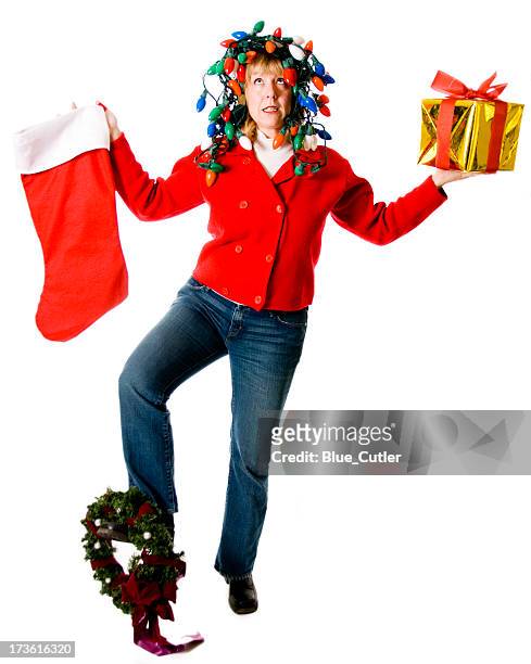 crazy, overwhelmed christmas woman juggling - christmas stress stock pictures, royalty-free photos & images