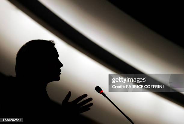 Secretary of State Hillary Clinton is seen in silhouette while delivering her speech during the opening of the 16th session of the United Nations...