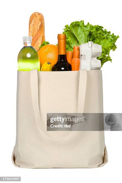 close-up of credit card and groceries in canvas tote - textile bag stock pictures, royalty-free photos & images