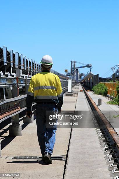 a coal terminal workman walking outdoors - australian mining stock pictures, royalty-free photos & images