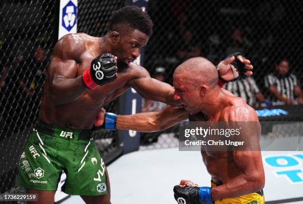 Edson Barboza of Brazil punches Sodiq Yusuff of Nigeria in a featherweight fight during the UFC Fight Night event at UFC APEX on October 14, 2023 in...
